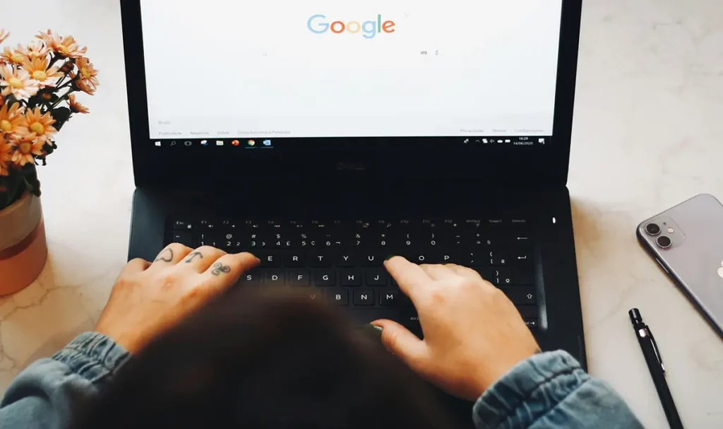 A laptop open to a Google search screen